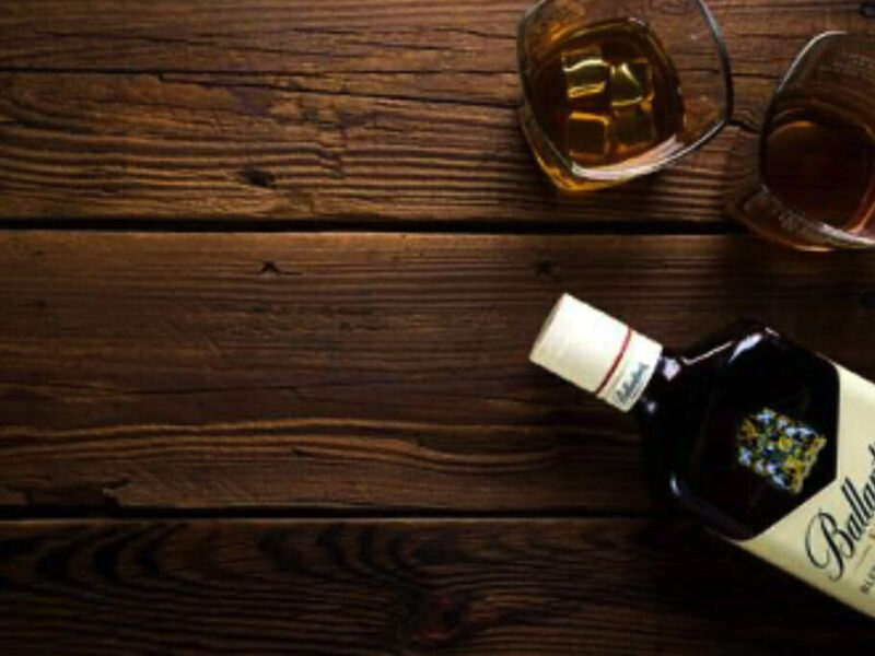 bottle of alcohol with glasses