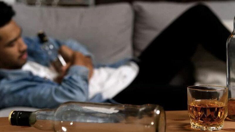 Drunk Man Sleeping On Sofa