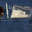 cocaine, spoon, and needle in jeans pocket