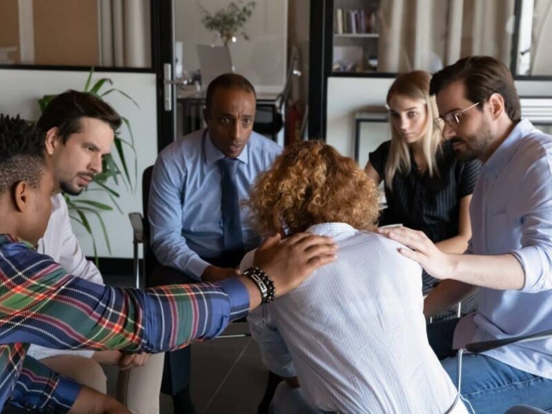 Depressed Woman Feeling Unhappy in a group therapy session